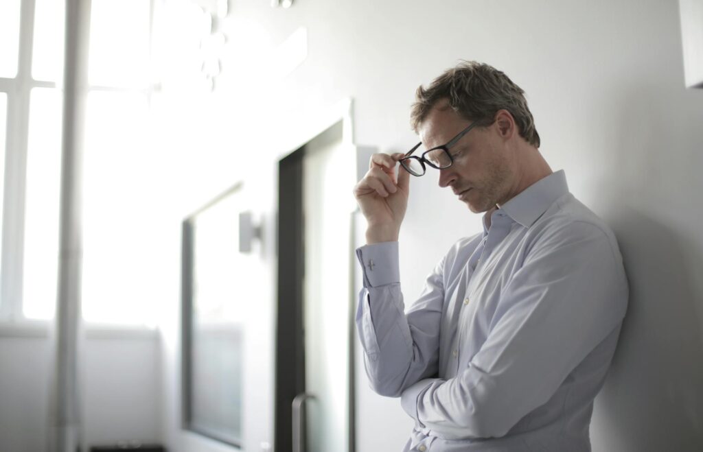 Stressed university leader with the prospect of redundancies.