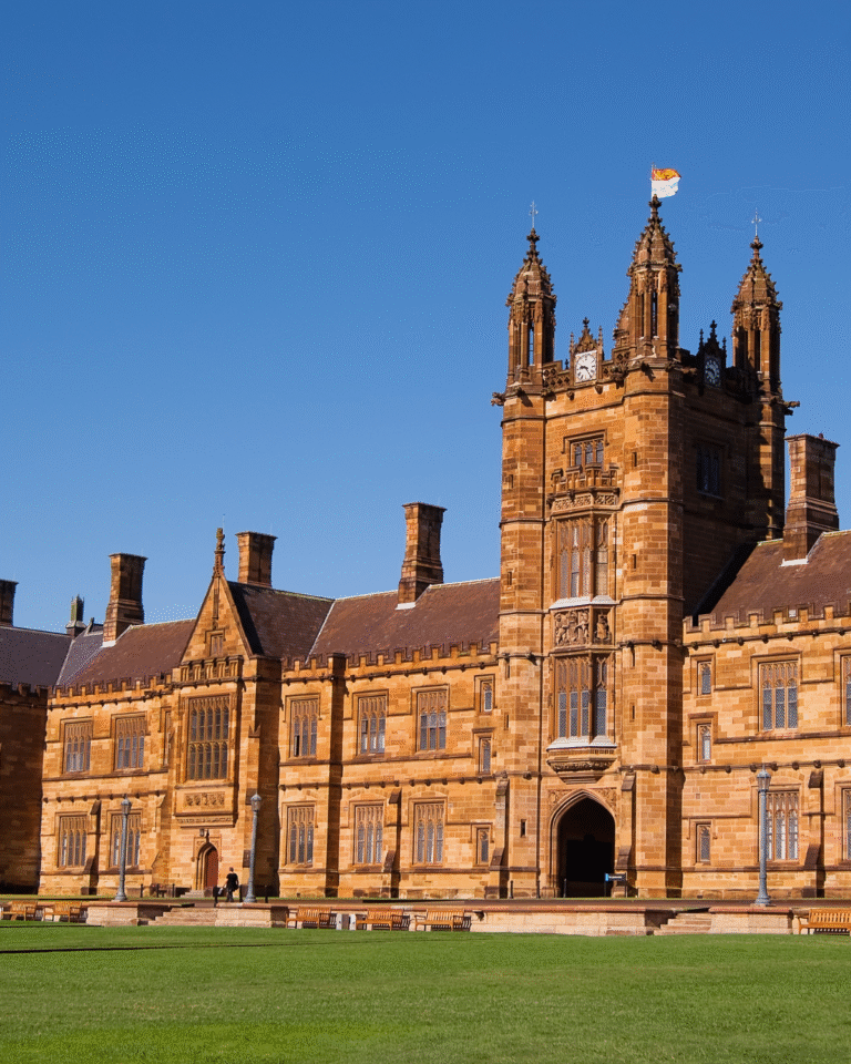 A higher education institution, traditional building in the daylight with a blue sky behind it.